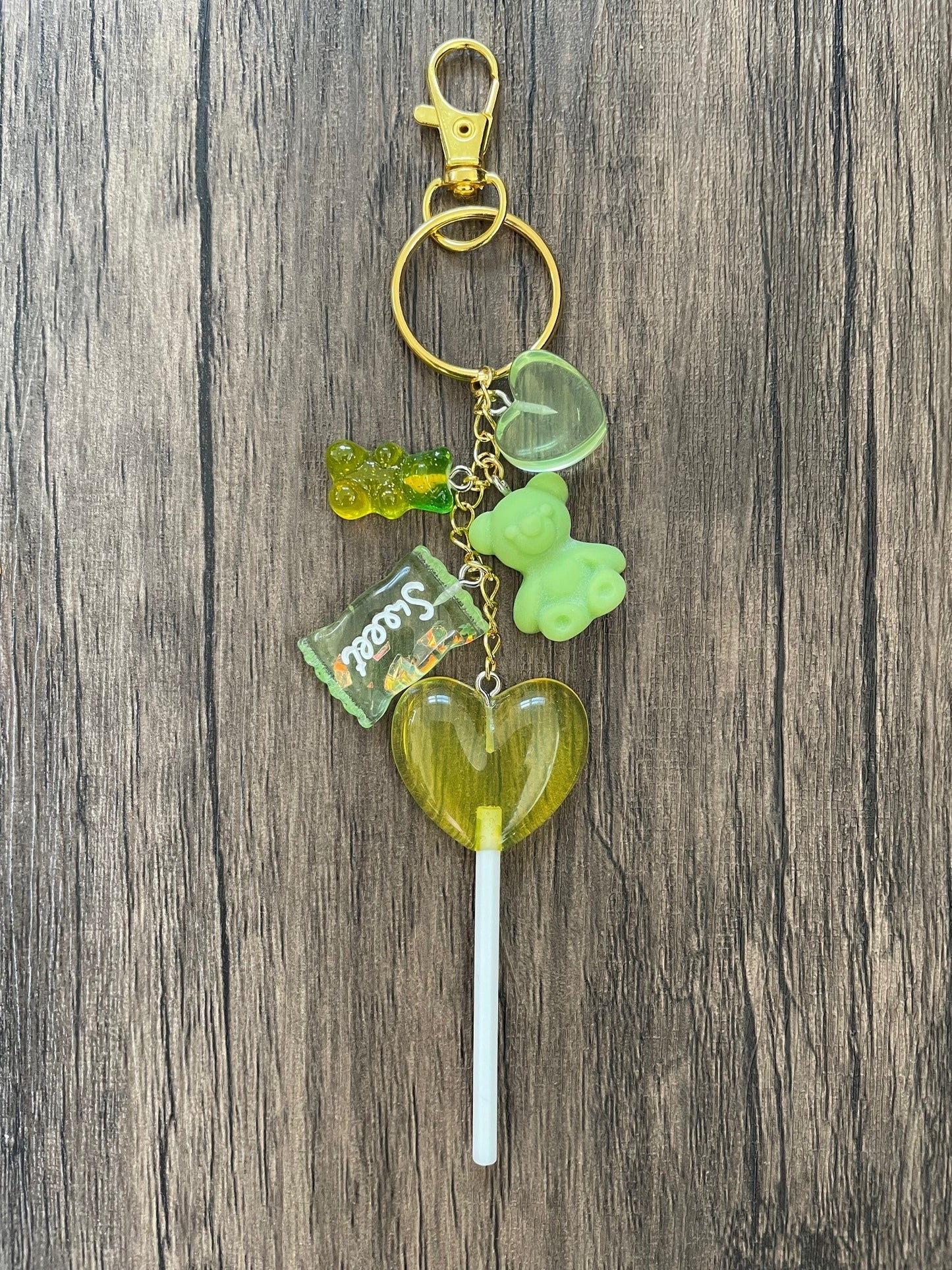 Love Candy Green Gummy Bear, Lollipop, and Hearts Gold Bag Charm