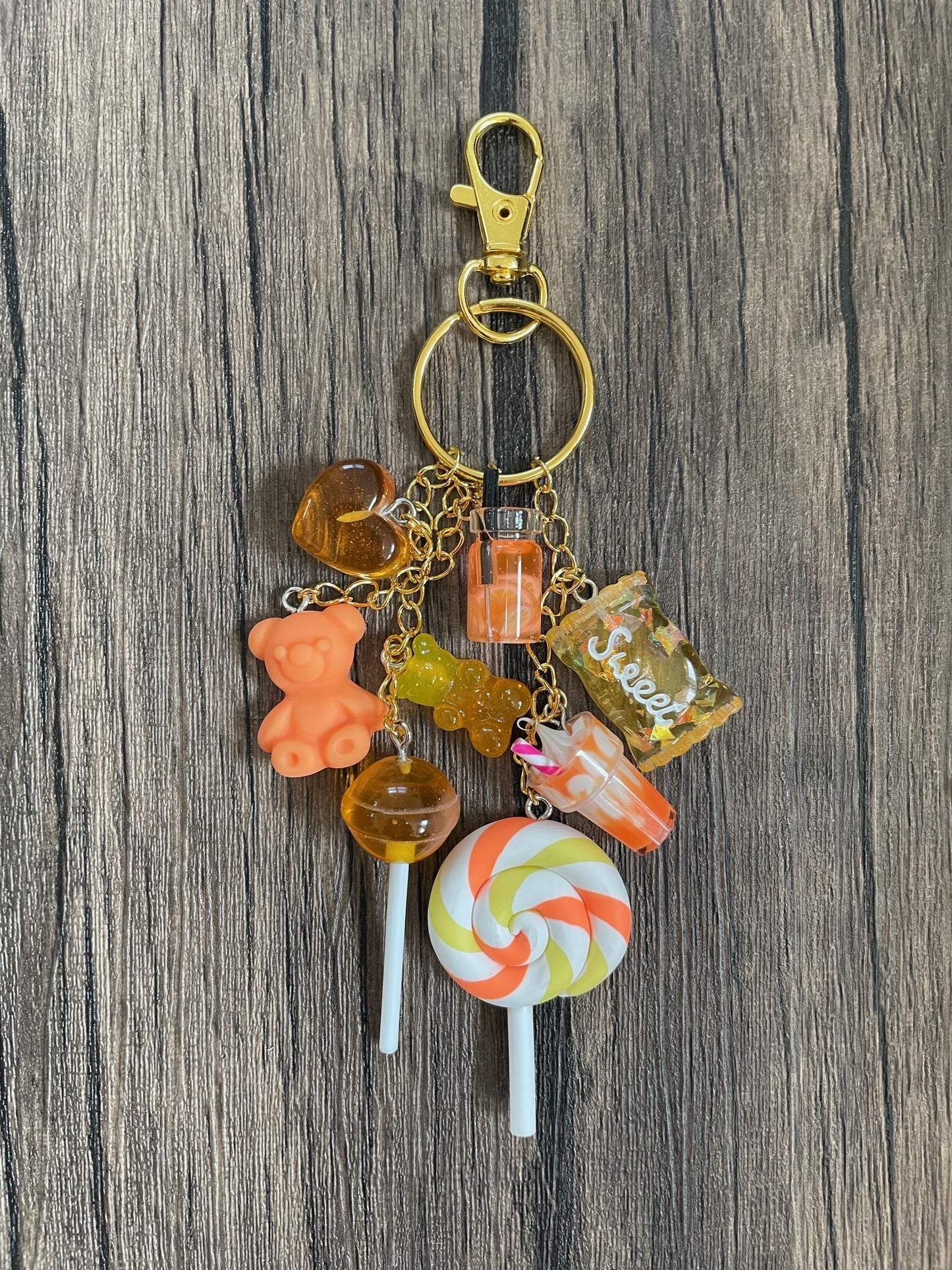Love Candy Orange Milkshake, Gummy Bear, Lollipop, and Hearts Gold Bag Charm
