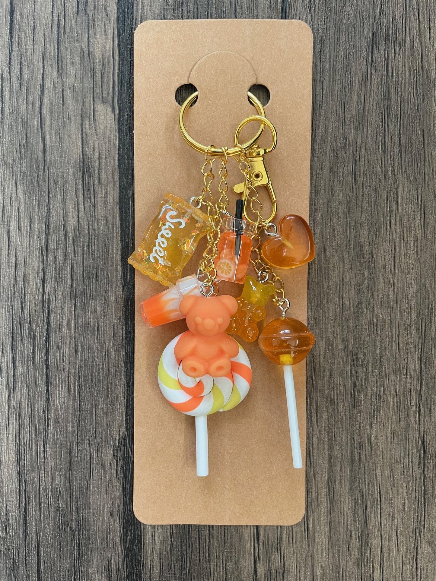 Love Candy Orange Milkshake, Gummy Bear, Lollipop, and Hearts Gold Bag Charm